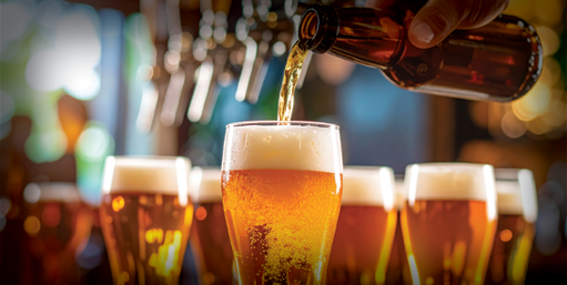Image of beer being poured into glass; links to selections of beers